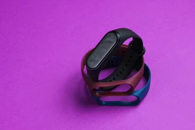 Smartwatch with interchangeable silicone bands in multiple colors on a vibrant purple background, showcasing options to replace Fitbit watch bands for workouts and style.