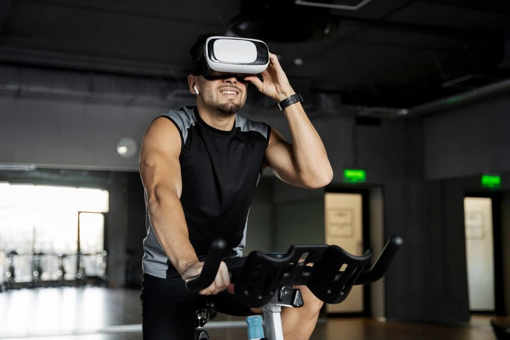A man using VR technology for an immersive smart gym cycling workout.