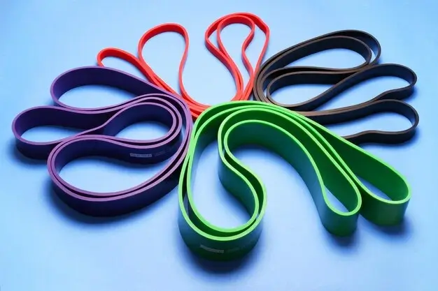 Colorful resistance bands for strength training in a small space gym.