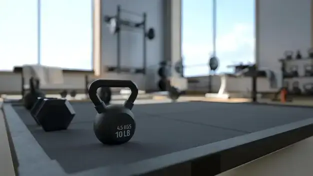 A well-equipped gym with kettlebells and dumbbells, perfect for the number 1 exercise to lose fat.