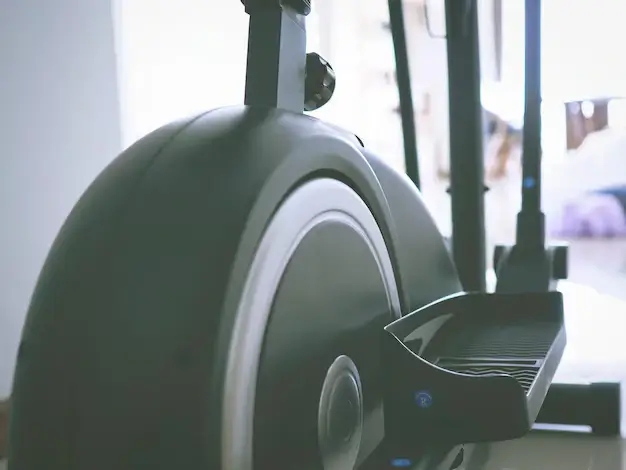 Close-up of an elliptical machine, highlighting its role in treadmill or elliptical workouts.