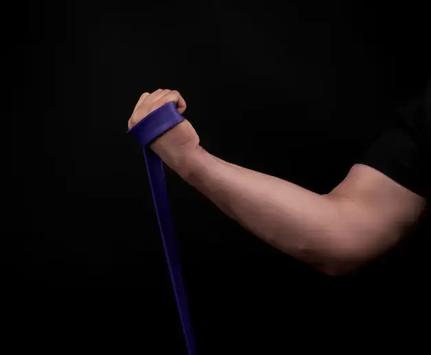 A strong arm demonstrating resistance bands vs weights with a blue resistance band.