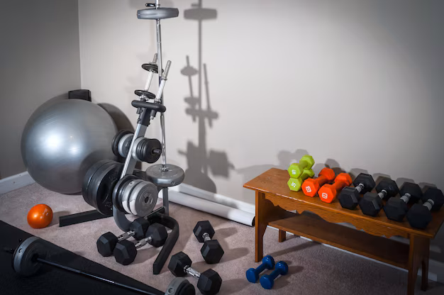 Home gym setup with a weight stack machine and dumbbells for a complete workout.